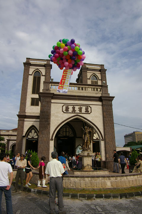 Balloons floating above church