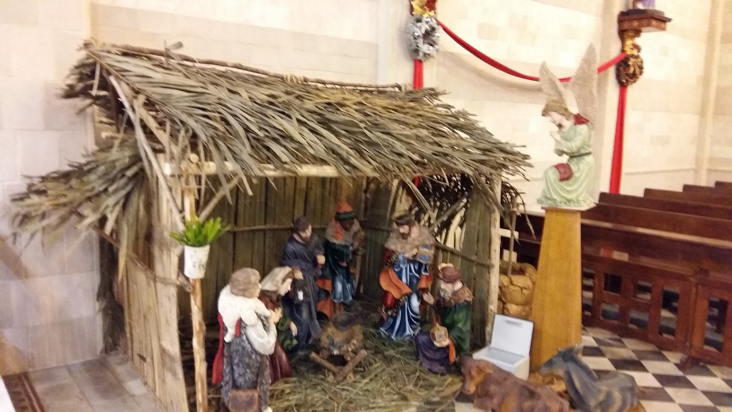 OA builders from Kg Sekam in front of their beautifully crafted crib