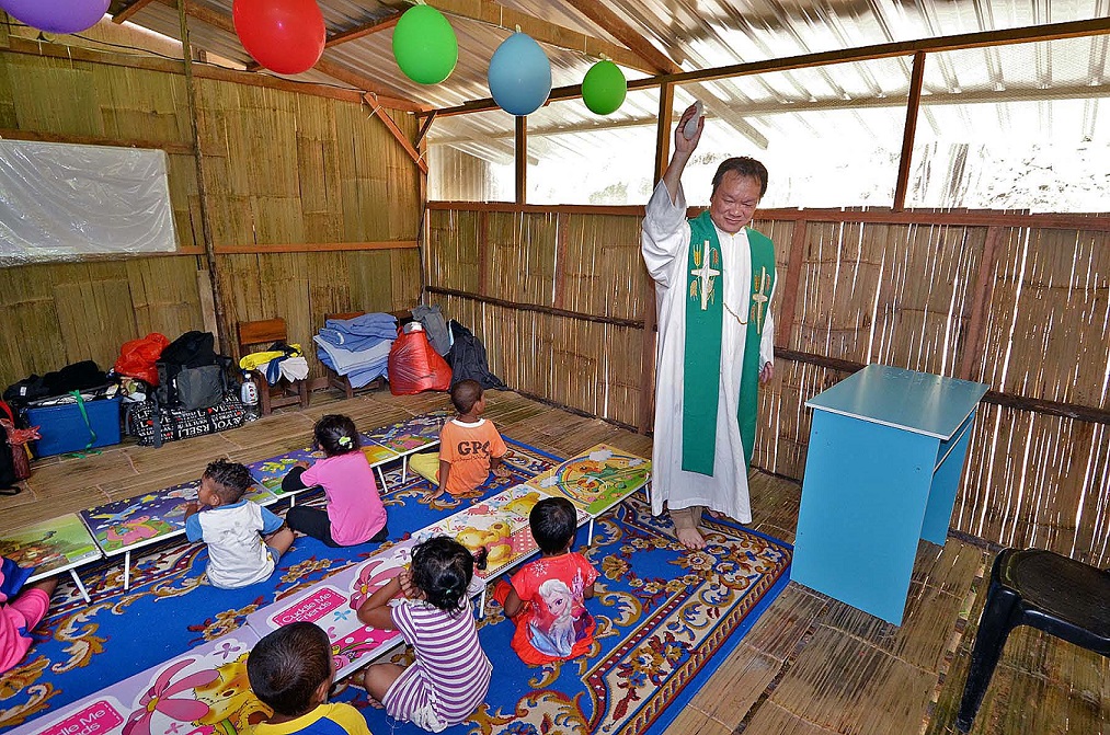 Fr Liew blessing classroom