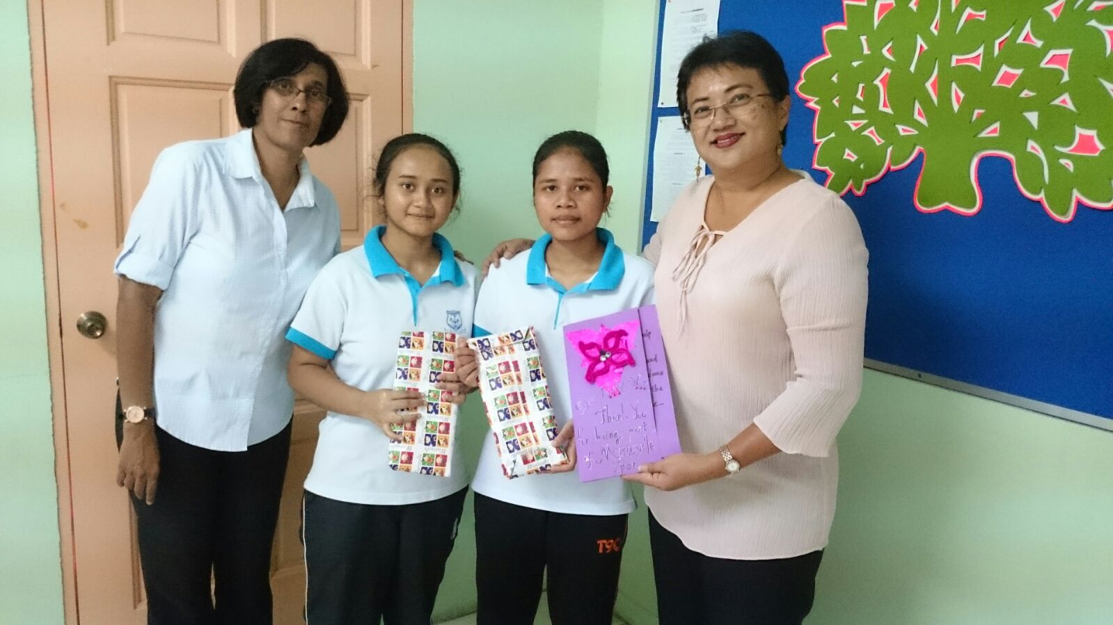 Graduation day for Molly and Wassa with Mariaville principal and teacher