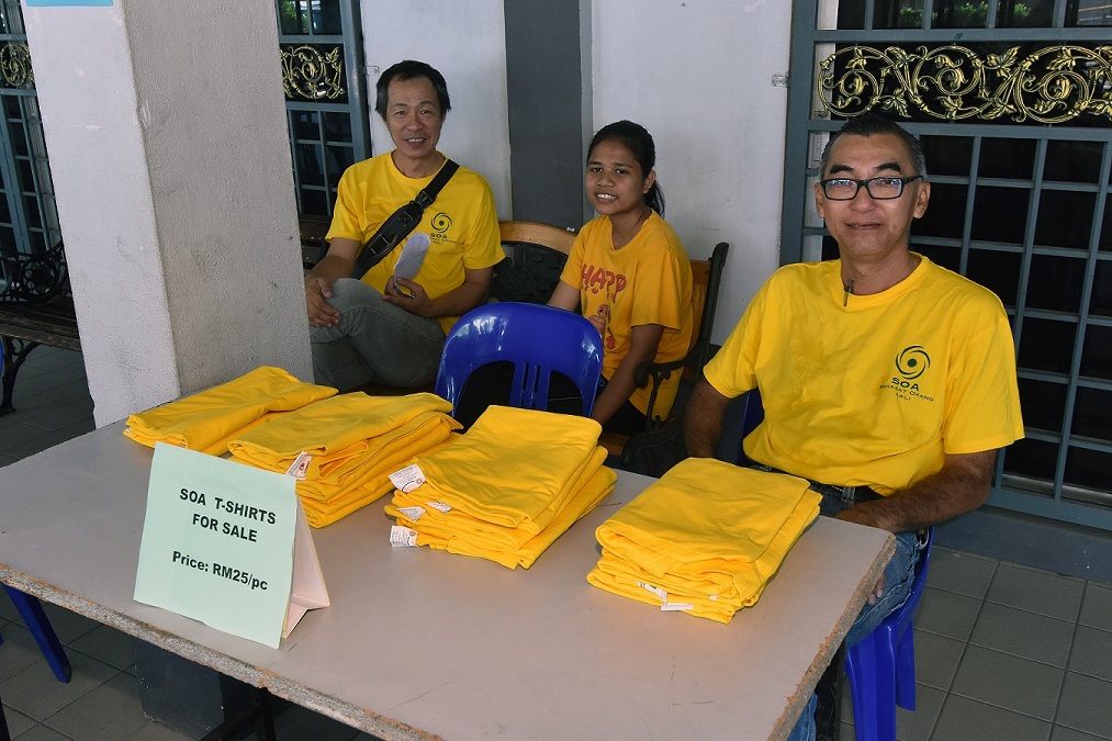 SOA members selling T-shirts for fundraising