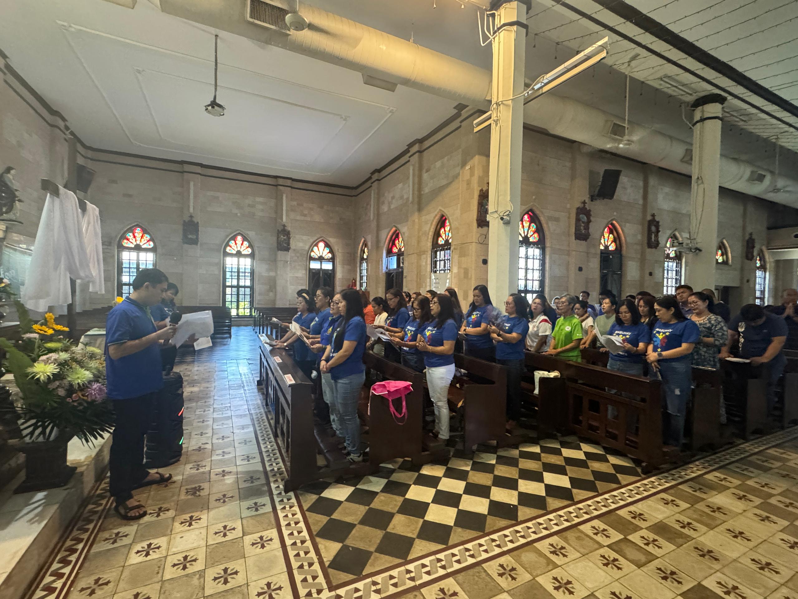 Filipino Group praying Way of the Cross in Tagalog